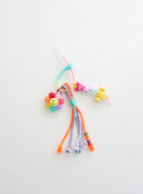 Colorful beaded keychain with smiley face on a white background