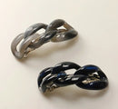 Navy and grey hair clips with a chain-link design on a white background