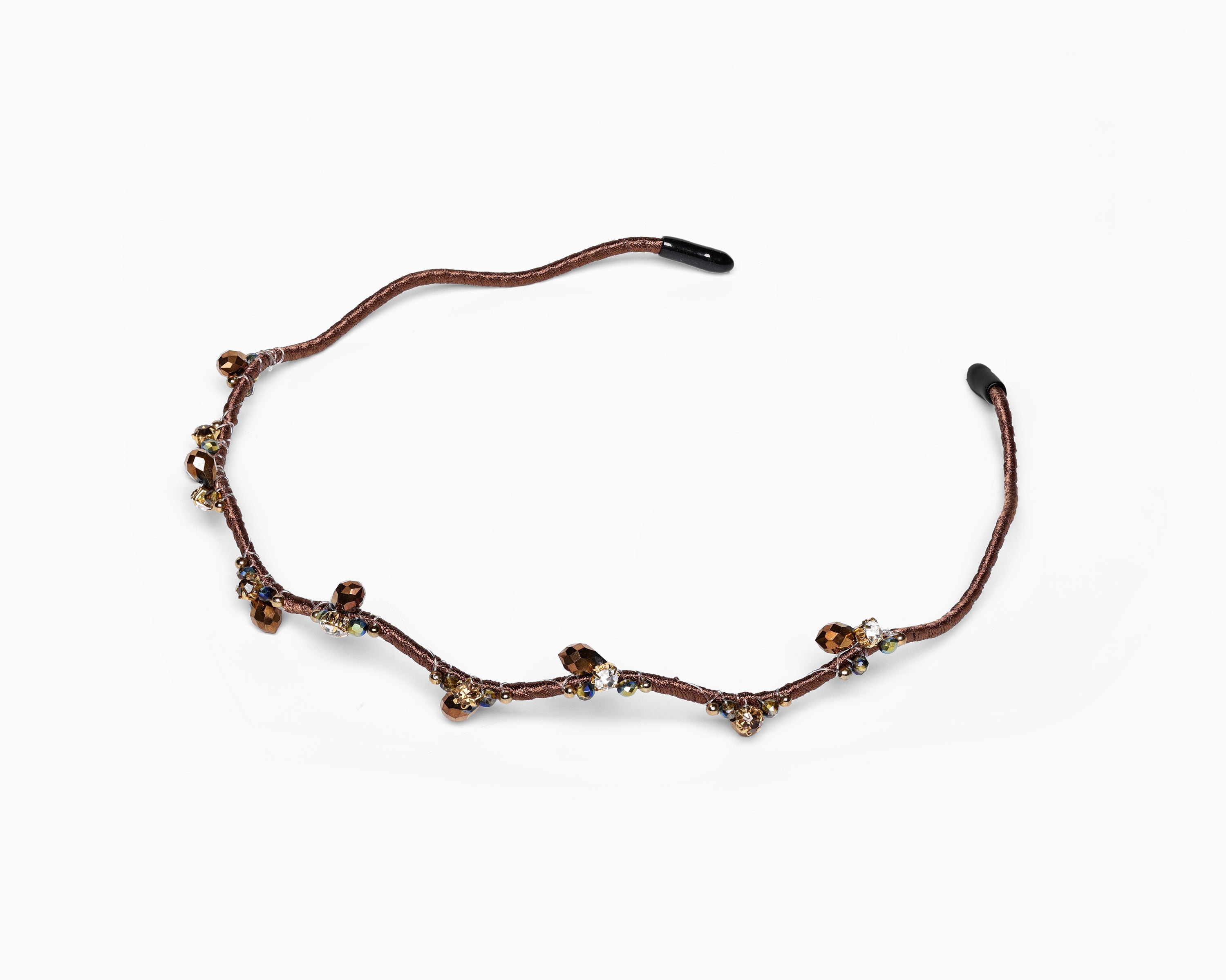 a hairband with branch-like design and small crystal in brown color.